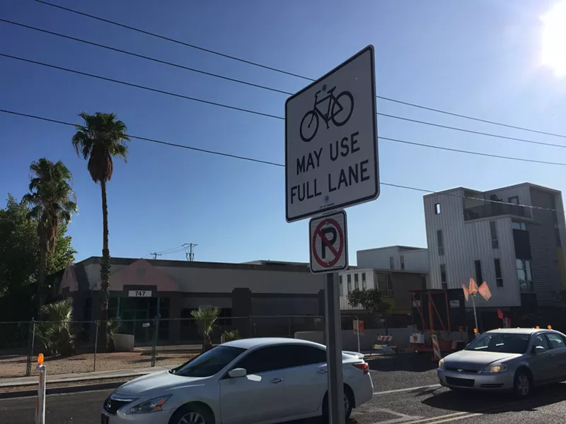 Image: A sign indicating a bike path at West Roosevelt Street and Seventh Avenue.