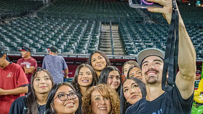 Corbin Carroll takes a selfie with fans