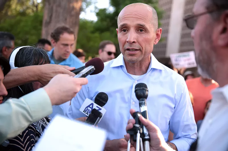 Image: David Garcia at a 2017 announcement for his campaign for Arizona governor. Garcia's digital director resigned after a reporter uncovered old tweets that disparaged Arizona and the U.S.