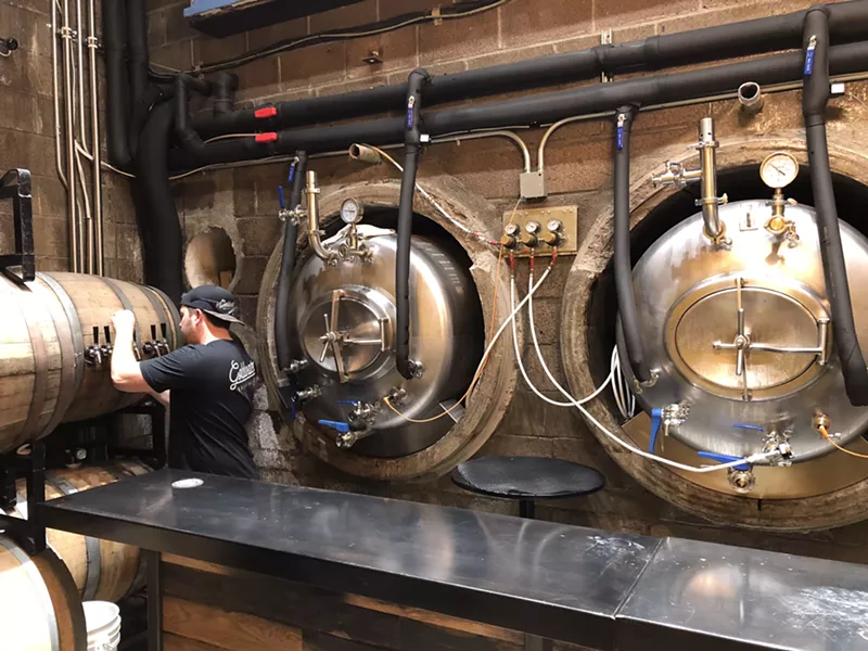 Image: Jordan Gregory pours a beer in Goldmine