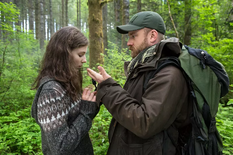 Image: Thomasin McKenzie (left) plays 13-year-old Tom, the daughter of Will (Ben Foster), and though the two have been hiding out in a large public park, there's much more to their survival story in Leave No Trace.