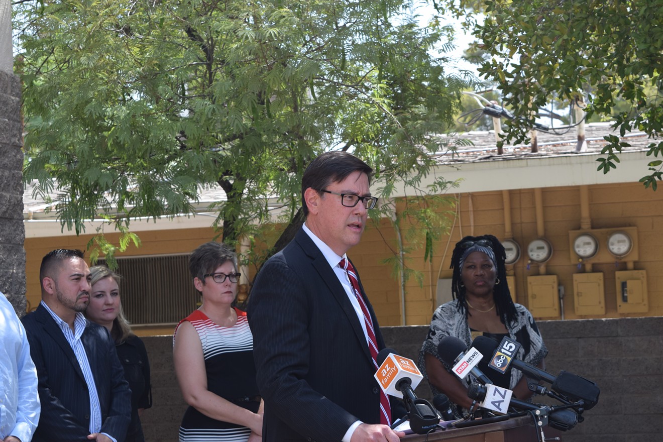 State Senator and Assistant Minority Leader Steve Farley, a Democrat, addresses reporters outside of a makeshift shelter for immigrant children on Monday.