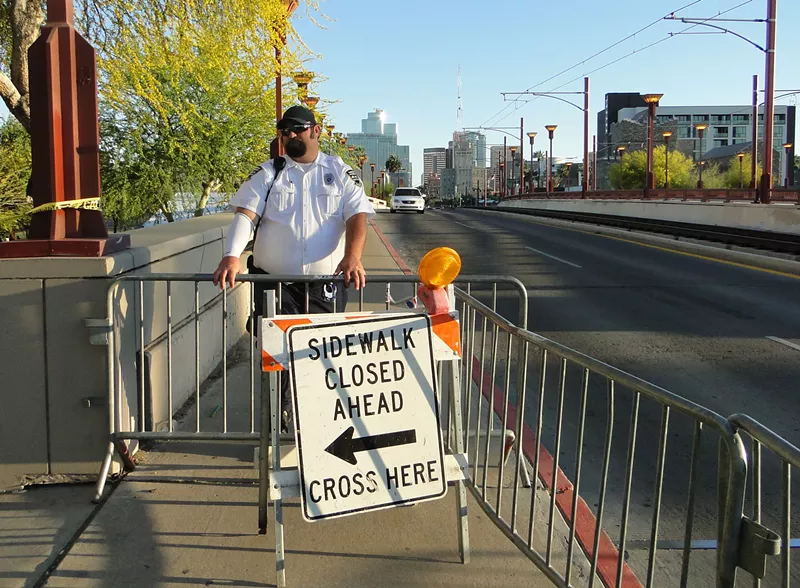 Image: Security was heavy in and around Margaret Hance Park Sunday. Police stopped pedestrians crossing the Central Avenue bridge.