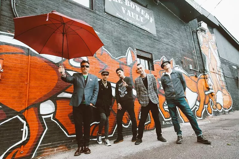 Image: The band The Defiant stands against a wall.