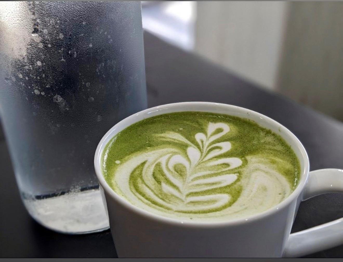 The matcha latte — one of several coffee options at JL Patisserie.
