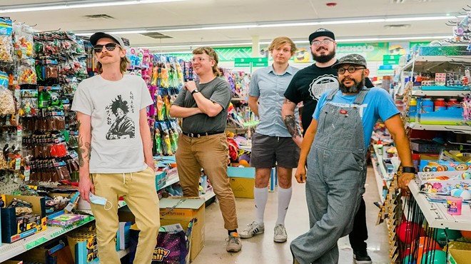 Members of band Playboy Manbaby inside a store