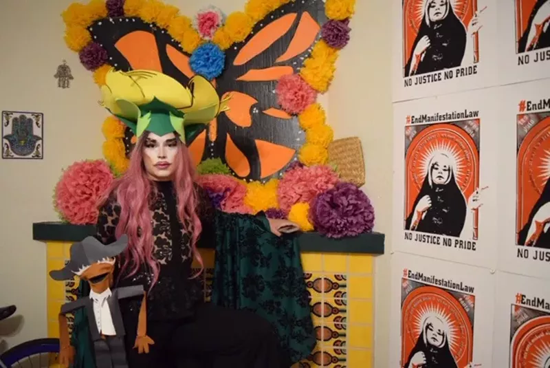 Image: Xyra Flores poses with her puppet, El Viejo, before she performs.