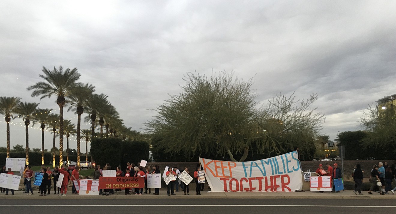 Protesters gathered outside the Westin in Scottsdale on December 4, 2019 to protest Arizona legislators' attendance at a summit of the American Legislative Exchange Council.