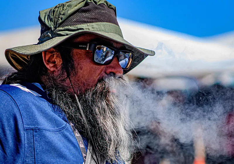 Image: An Errl Cup attendee takes a complimentary hit from a laser dab rig on Sunday October 6, 2024.