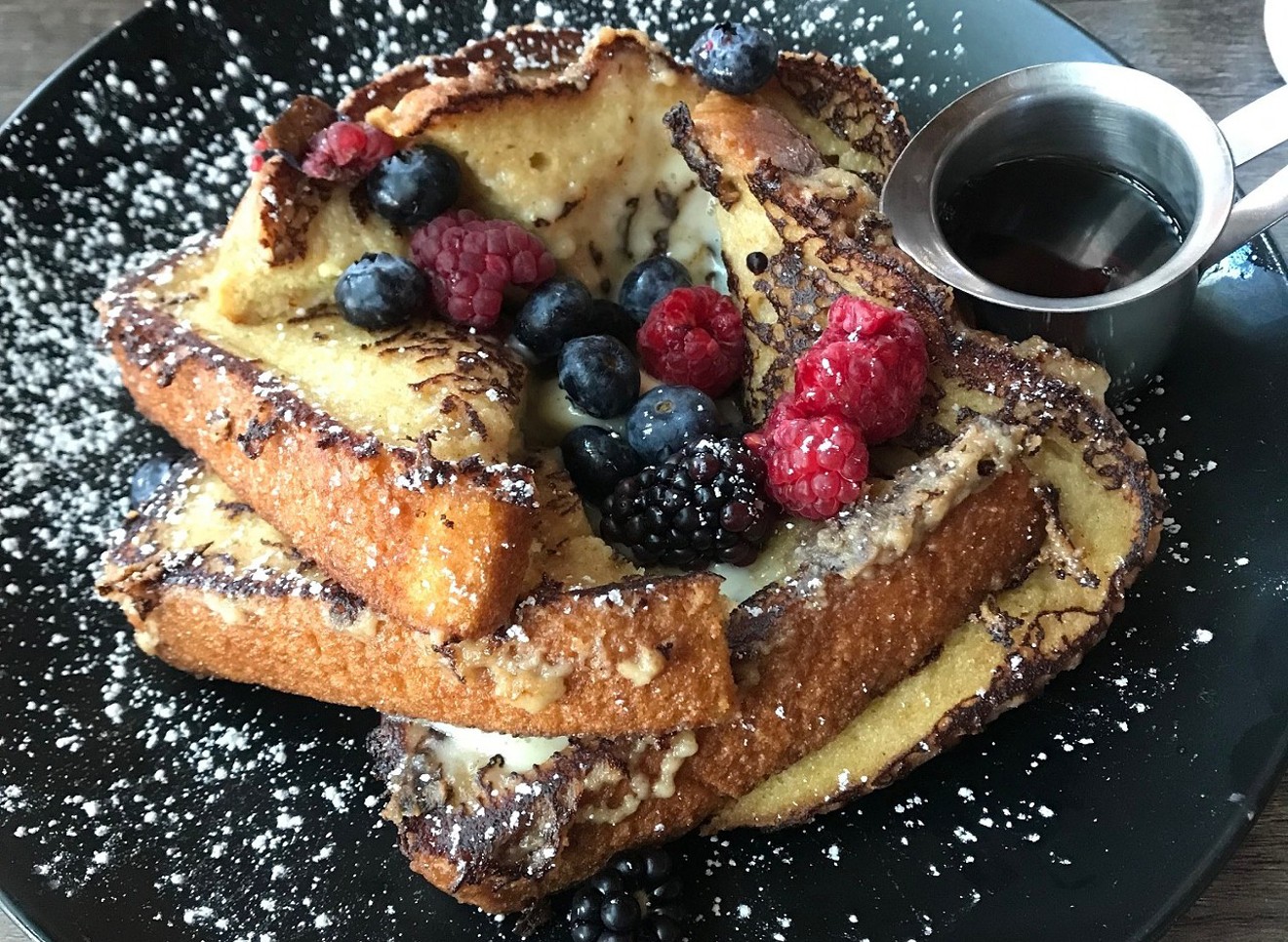 Mascarpone French toast topped with fresh berries and powdered sugar at OAK on Camelback.