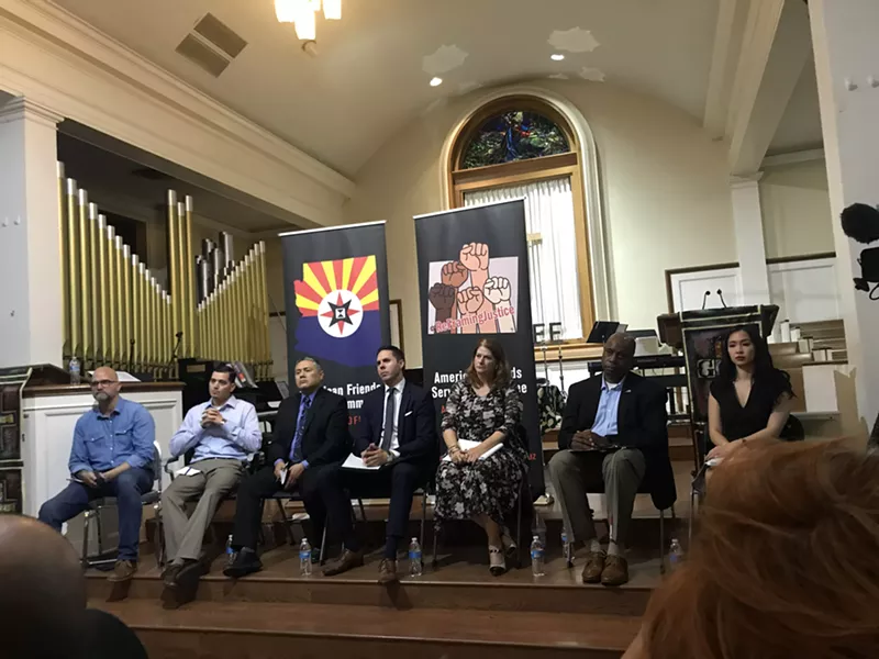 Image: From left: Joe Watson, Danny Howe, representative Diego Rodriguez, Tim Roemer, Karen Hellman, representative Walt Blackman, and Laetitia Hua at a August 2019 town hall on conditions in state prisons.