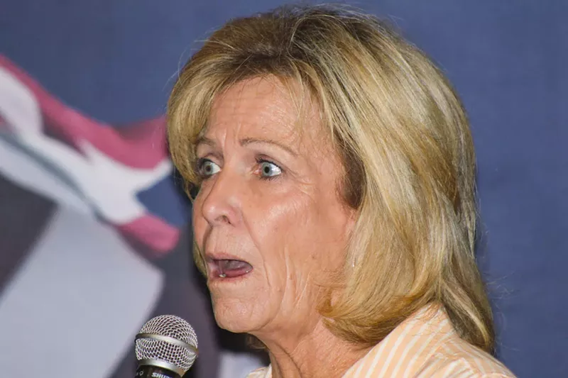 Image: Mary Ann Mendoza, who has dressed in blackface in the past, made false claims about migrants during a June 15 event.