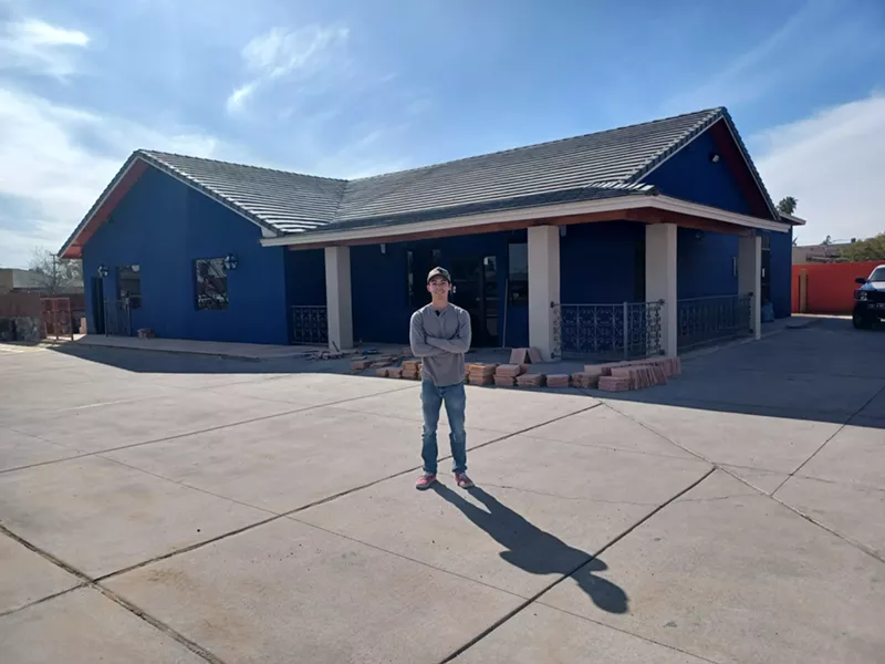 Image: Ulysses Verdugo stands in front of Cien Fuegos, a new restaurant he opened with his father Javier.