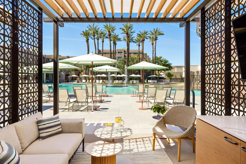 Image: A cabana at a hotel pool.