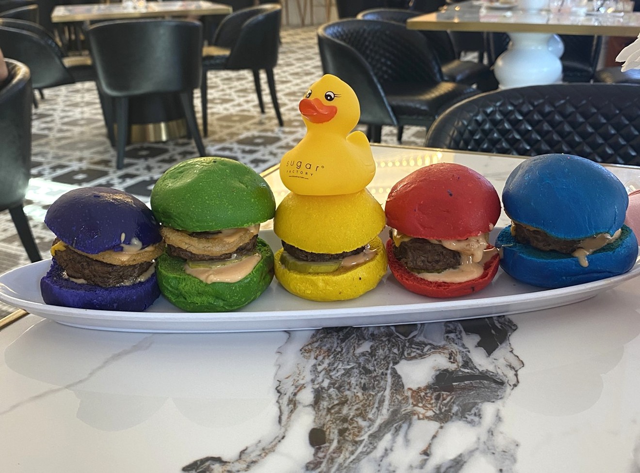Sugar Factory in Glendale is a fun spot for a celebratory meal. The Rainbow Sliders even come with a gift as diners can keep the duck as a souvenir.