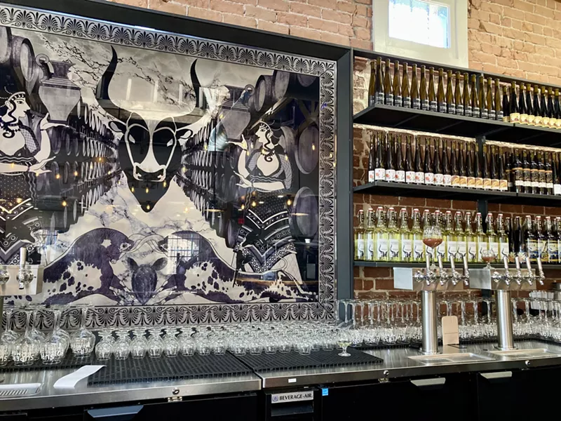 Image: Hundreds of bottles of mead, cider, etc. are lined up behind the bar at Superstition Downtown.