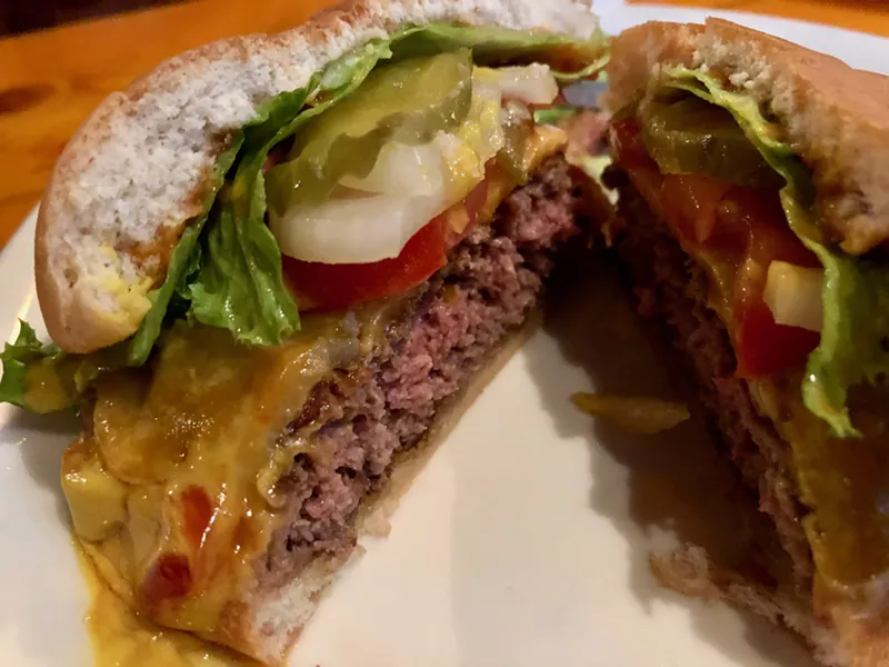 Image: A look inside the Cheese Drummer burger at The Dirty Drummer.