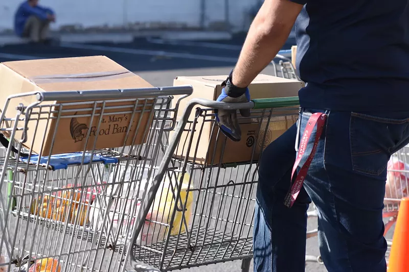 Image: The number of people visiting St. Mary's Food Bank in downtown Phoenix doubled from Monday to Tuesday, as concerns about the global coronavirus pandemic worsen.