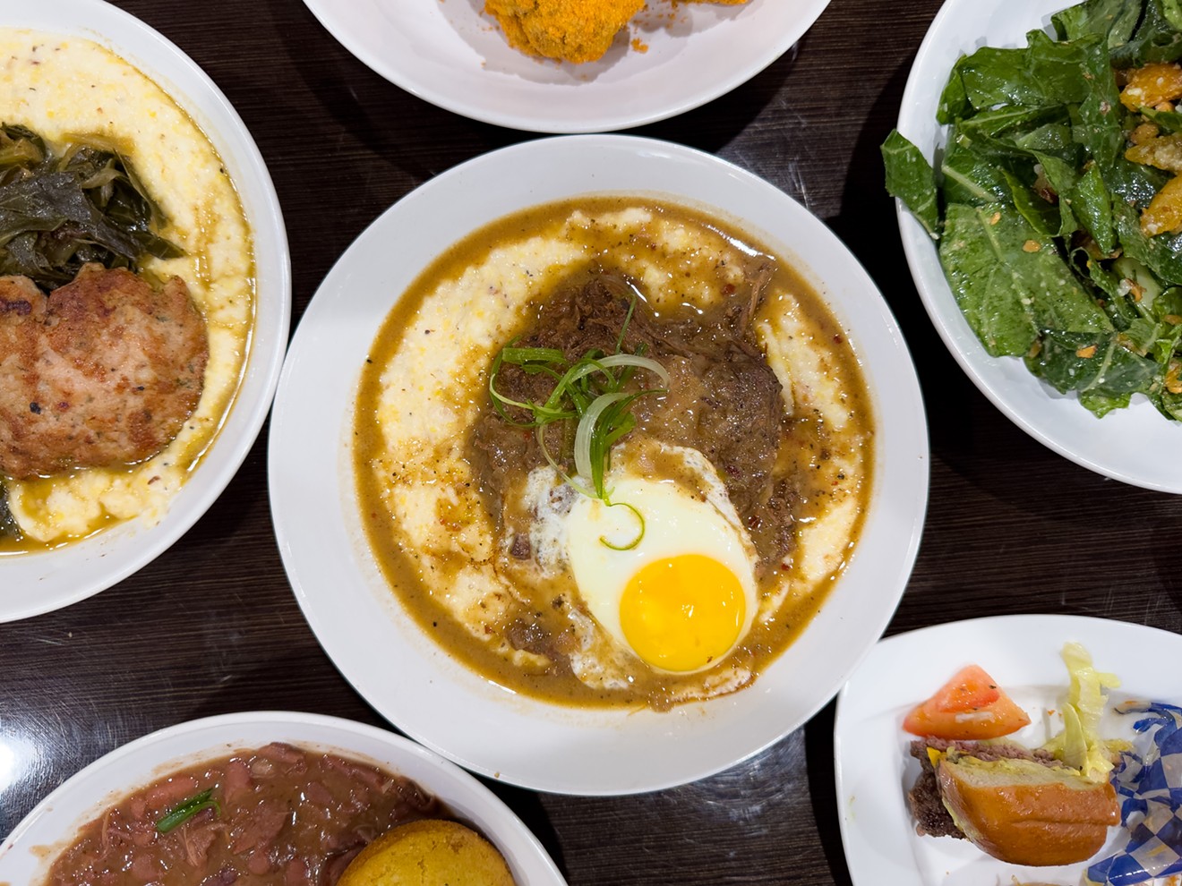 At CC's on Central, the debris and grits is a star — tender, saucy stewed beef on top of creamy, rough-hewn corn grits.