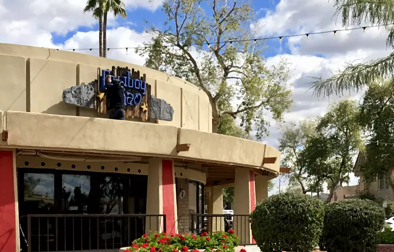 Image: Cowboy Ciao sign being removed for Drunk Munk's job fair and future opening.