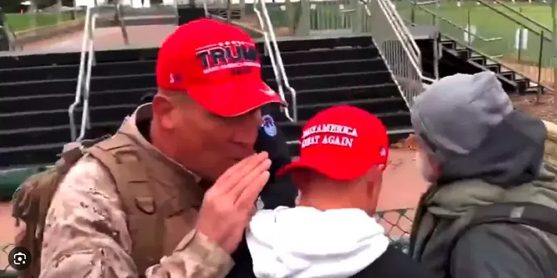 Image: Ray Epps whispers to Ryan Samsel before breaching a second barricade and storming the U.S. Capitol on Jan. 6, 2021.