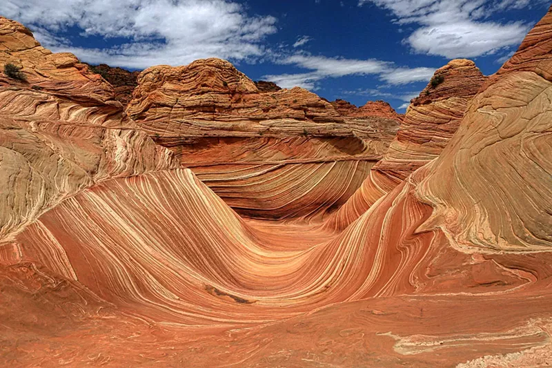 Image: The Wave can be found in the Paria Canyon-Vermillion Cliffs Wilderness Area near Lake Powell, south of the Utah border.