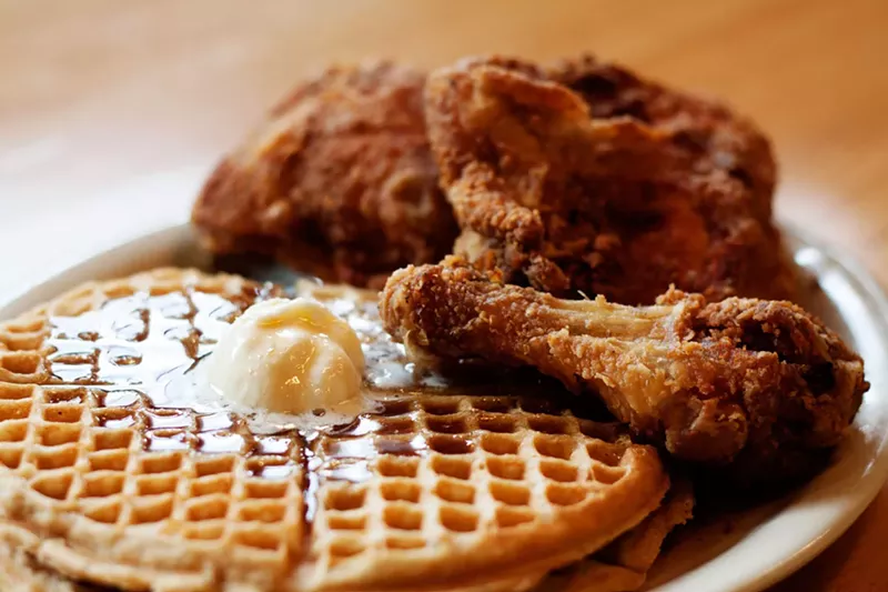 Image: The namesake of Lo-Lo's Chicken and Waffles barely fits on one plate.
