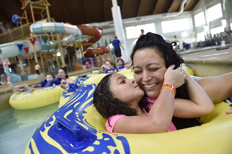 Image: A mother and child at a waterpark.