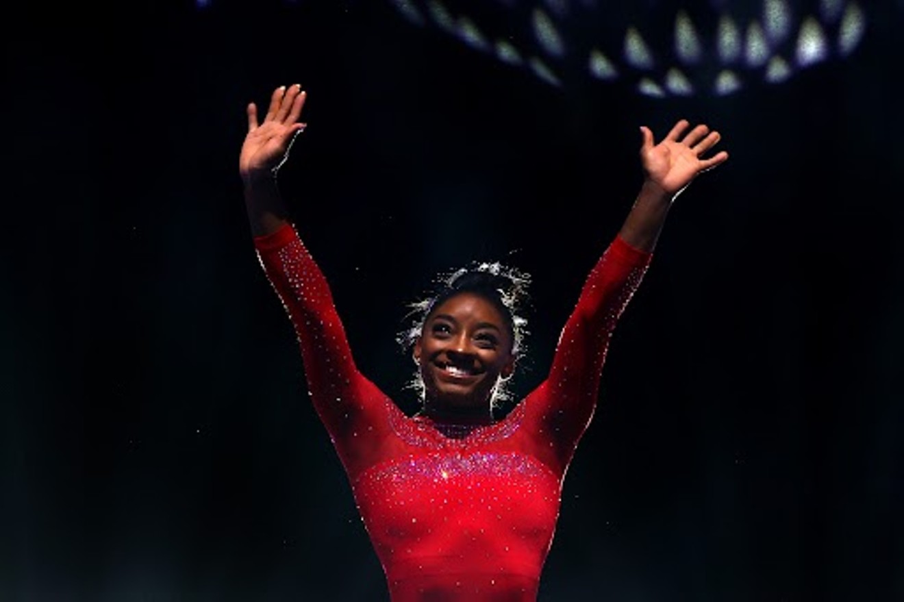 Simone Biles of Team United States acknowledges the crowd as she walks out ahead of the Women's Uneven Bars Final on Day Eight of the 2023 Artistic Gymnastics World Championships at Antwerp Sportpaleis on Oct. 7, 2023, in Antwerp, Belgium.