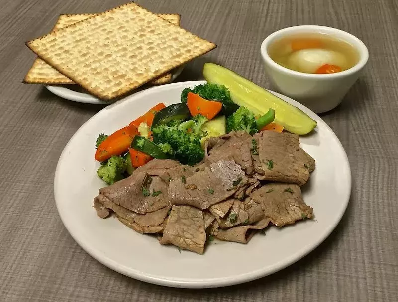 Image: Brisket, vegetables, matzoh ball soup, and more for Passover at Miracle Mile Deli.