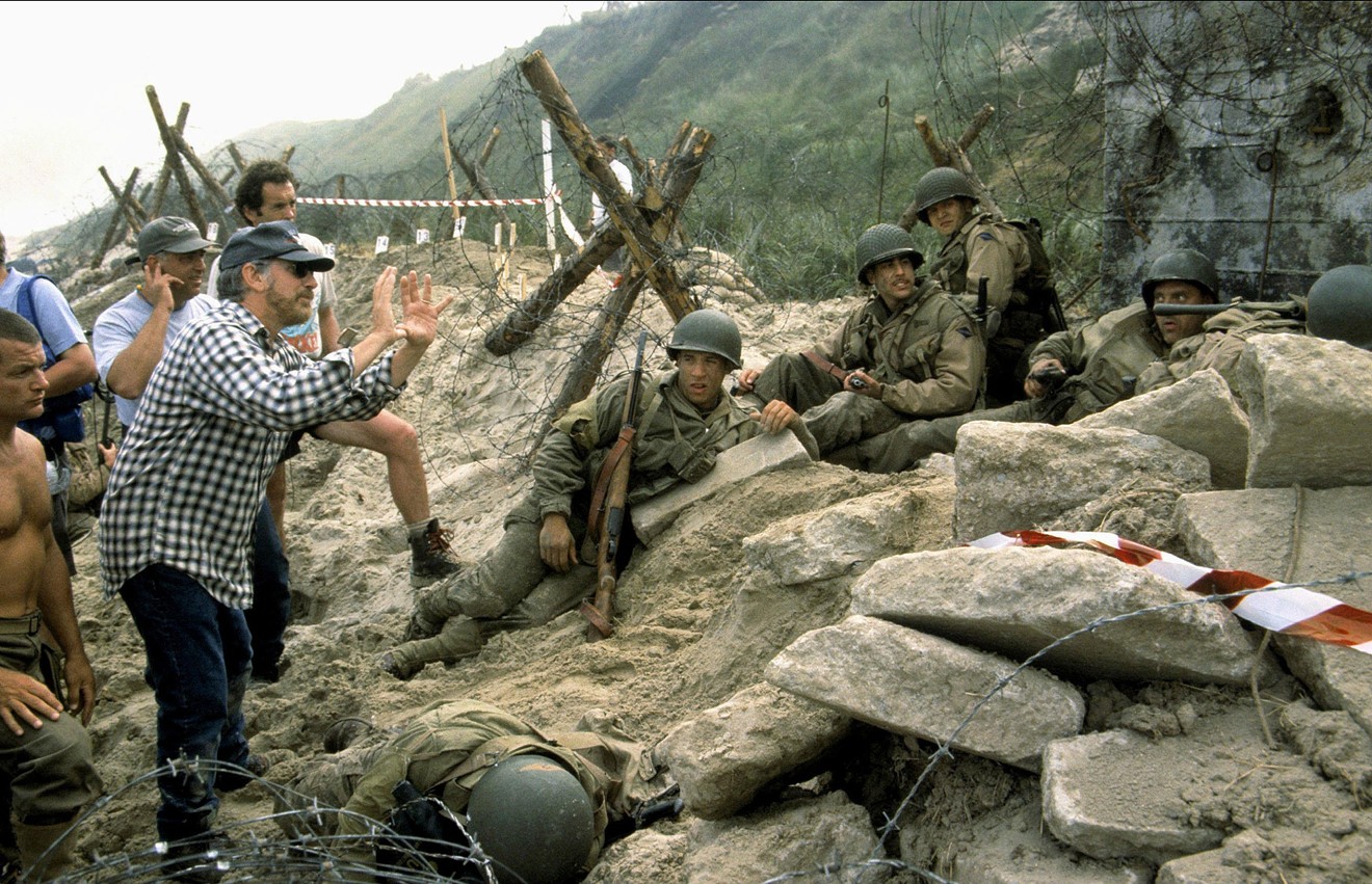 On the set of Saving Private Ryan in 1997, director Steven Spielberg  consults with actors Vin Diesel, Barry Pepper, Adam Goldberg, and Tom Sizemore.