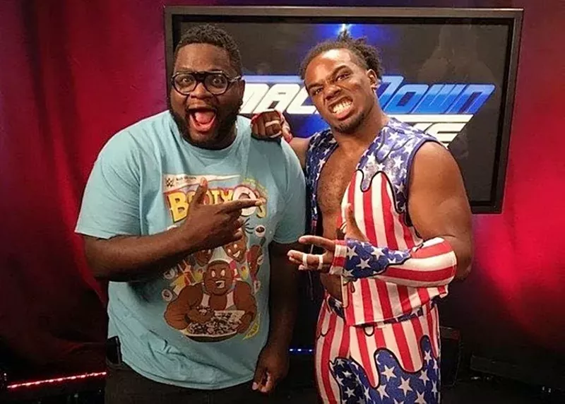 Image: Mega Ran (left) with WWE superstar Xavier Woods (right) backstage at an episode of SmackDown in 2017.