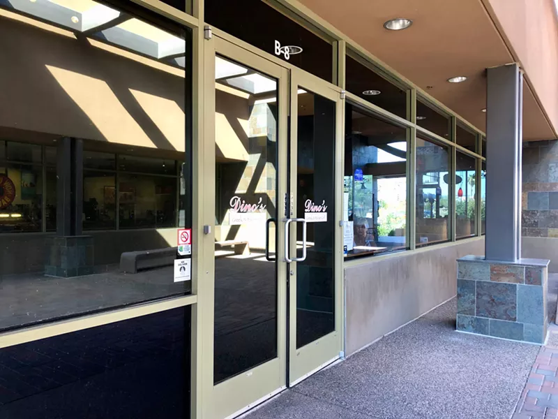 Image: The entrance to Dino's Greek & Italian Grill & Bar is almost literally hidden.