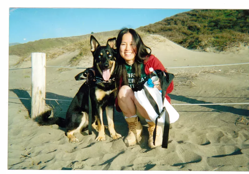 Image: Tomomi Hanamure and her dog, Blues, visiting America. Hanamure's life and death is the subject of Pure Land by Annette McGivney