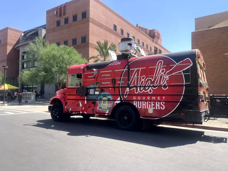 Image: One of the most unique rigs from Food Trucks PHX is the Aioli Burger school bus. It frequently parks on campus at Arizona State University.