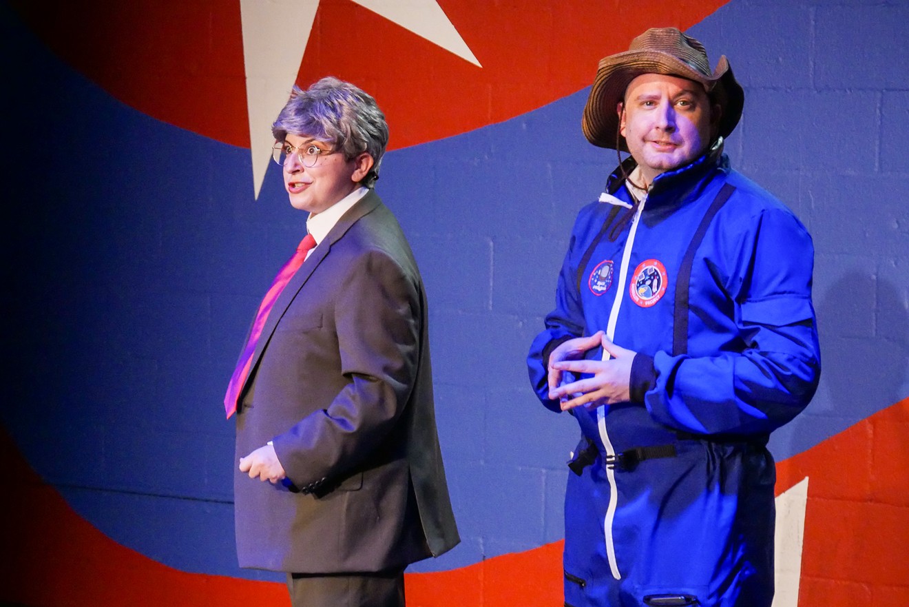 Joy Mamey as Mitch McConnell and Aaron Matijasic as Jeff Bezos in a Capitol Comedy sketch.