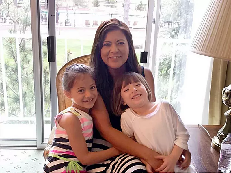 Image: Yulma Violette with her children Lauren (left) and Sarah.