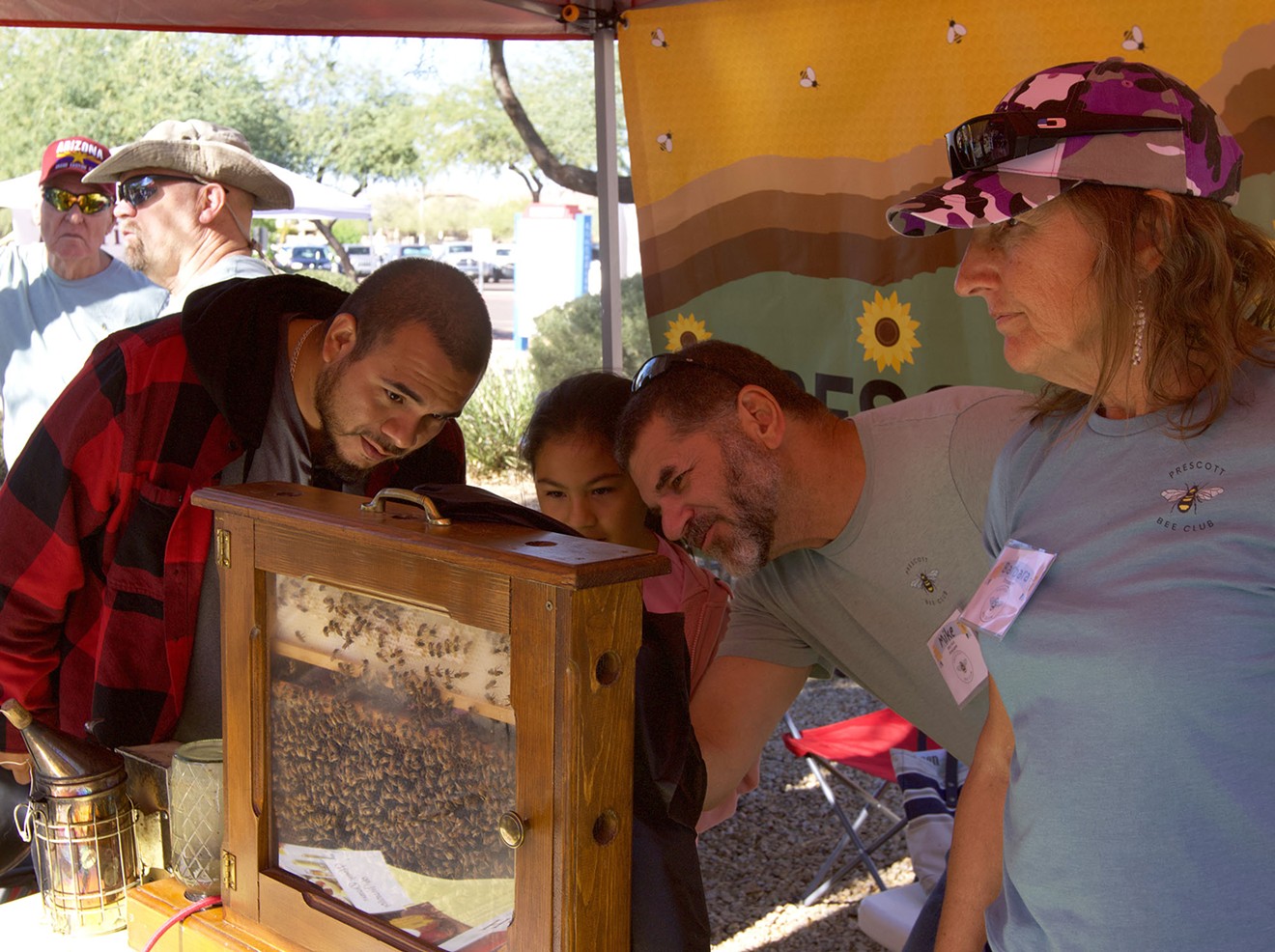 Prescott beekeepers show off their wooden beehive display at the November 2023 Arizona Honeybee Festival in Phoenix. They relocate beehives and provide beekeeping education.