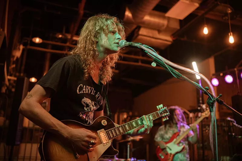 Image: Connor Kelly of the Black Hole, a blues-rock trio, performs at an April 24 benefit show to help Carvin Jones, one of Phoenix's most influential guitarists, pay for cancer treatments.