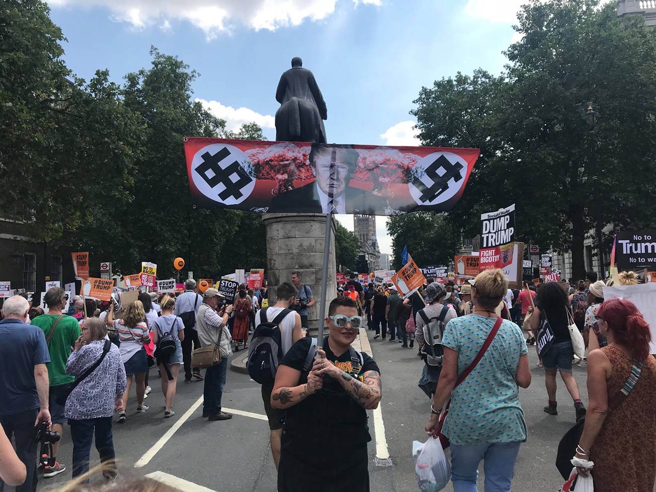 Carey Methley carries the anti-Trump flag in London on Friday, July 13.