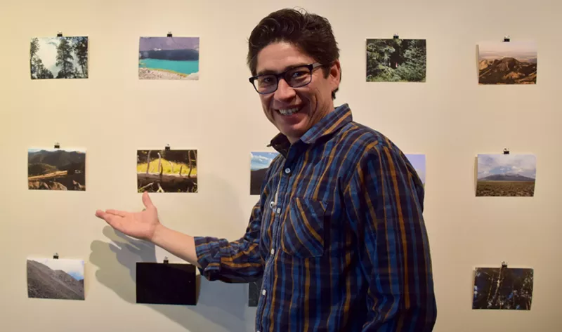 Image: Steve Yazzie pauses for a photograph during installation for his new exhibit at the Heard Museum.