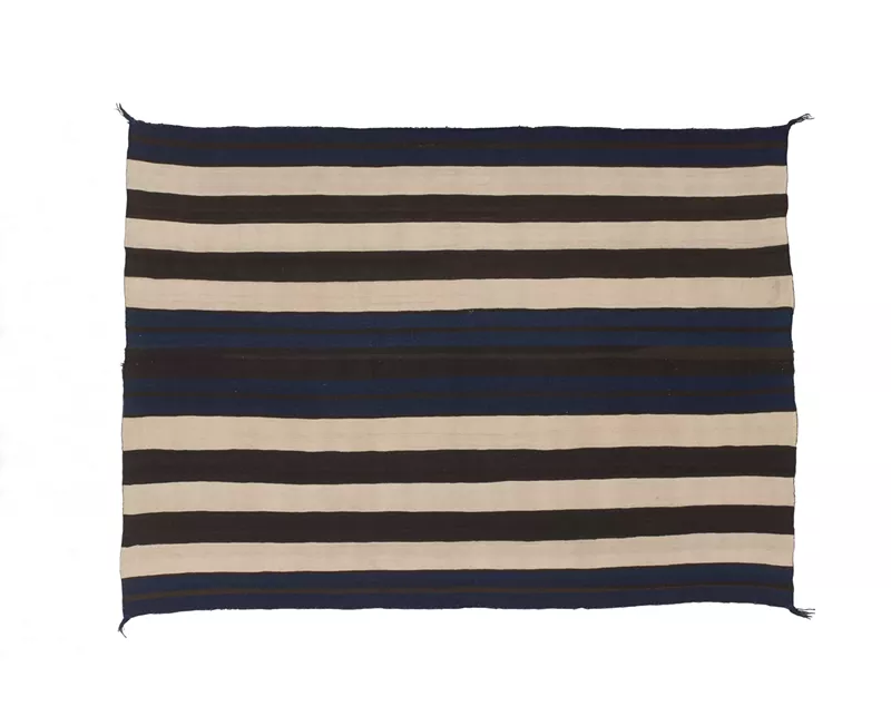 Image: Navajo, First Phase Ute-Style Chief Blanket, 1800-1850. Handspun wool, natural colors, indigo dye. 53 x 71 inches. Fred Harvey Fine Arts Collection at the Heard Museum, 196BL.