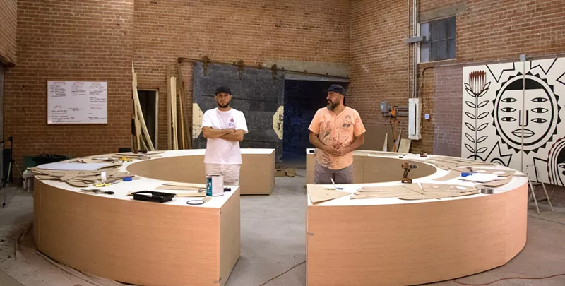 Image: Isaac (left) and Gabriel Fortoul working on an installation for Phoenix Art Museum.
