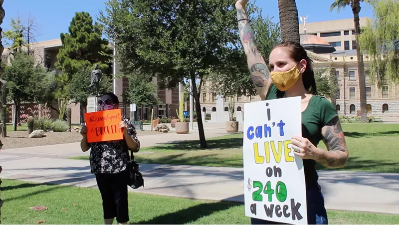 Image: Meschelle Hornstein was laid off from her job at the airport in March. She worries about providing for herself and her daughter when federal assistance runs out at the end of the month.