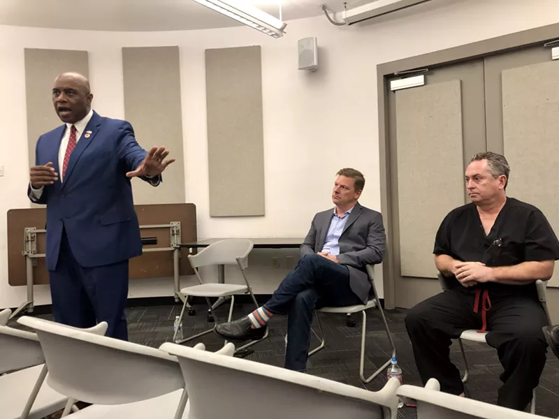Image: State Representative Walt Blackman, left, raised concerns about legalizing marijuana at a panel in Phoenix on Saturday.