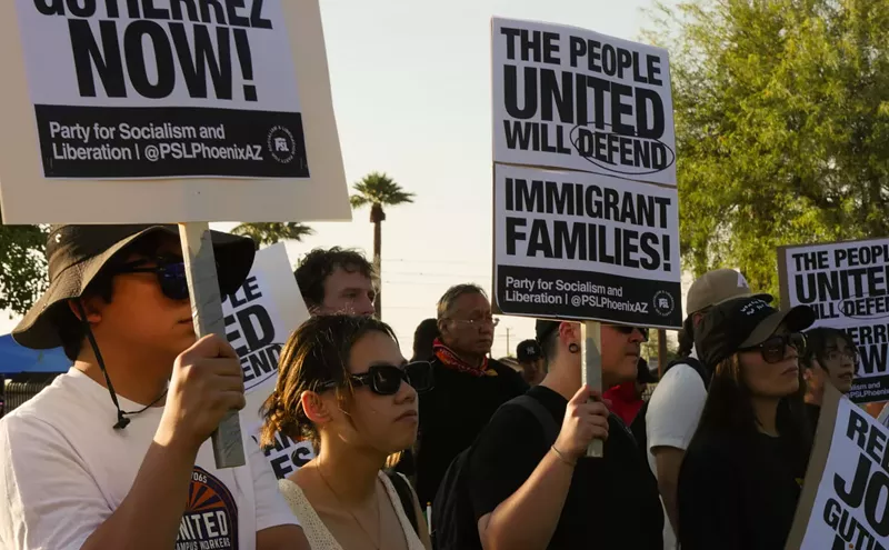 Image: ‘It’s giving Hitler’: Protesters demand ICE release arrested father