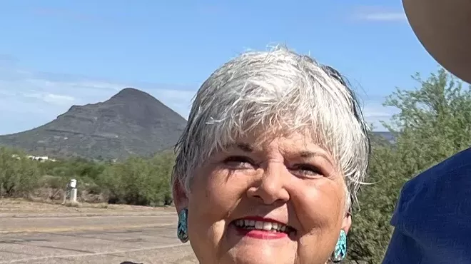 An older woman with white hair.