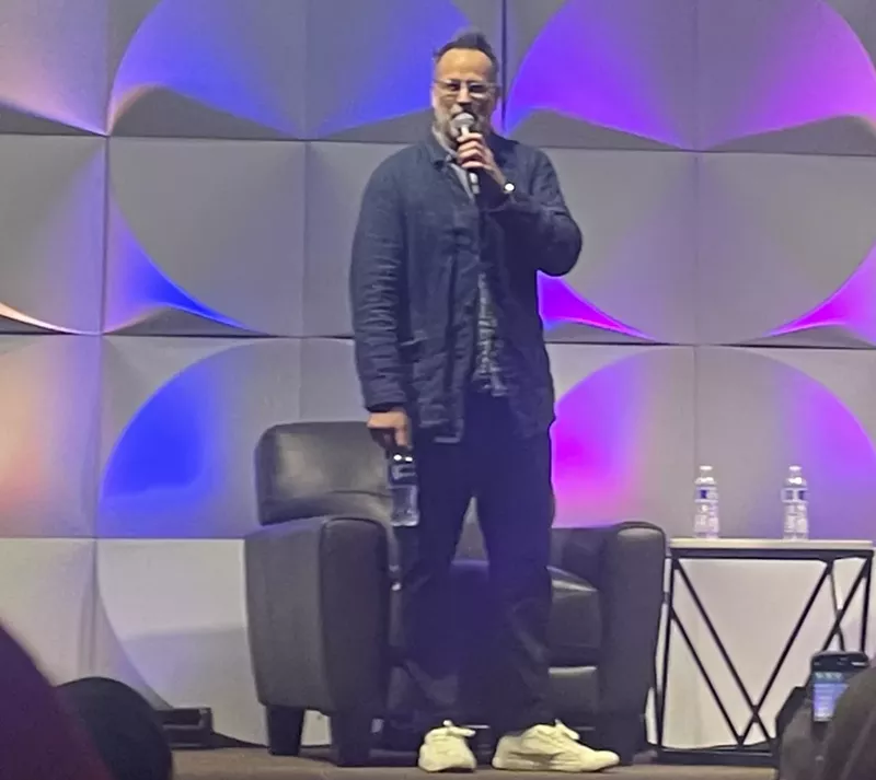Image: man stands on stage
