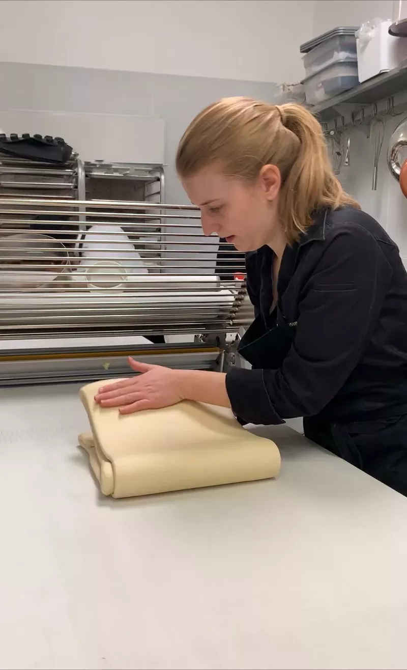 Image: Chef Jenna making croissant dough.
