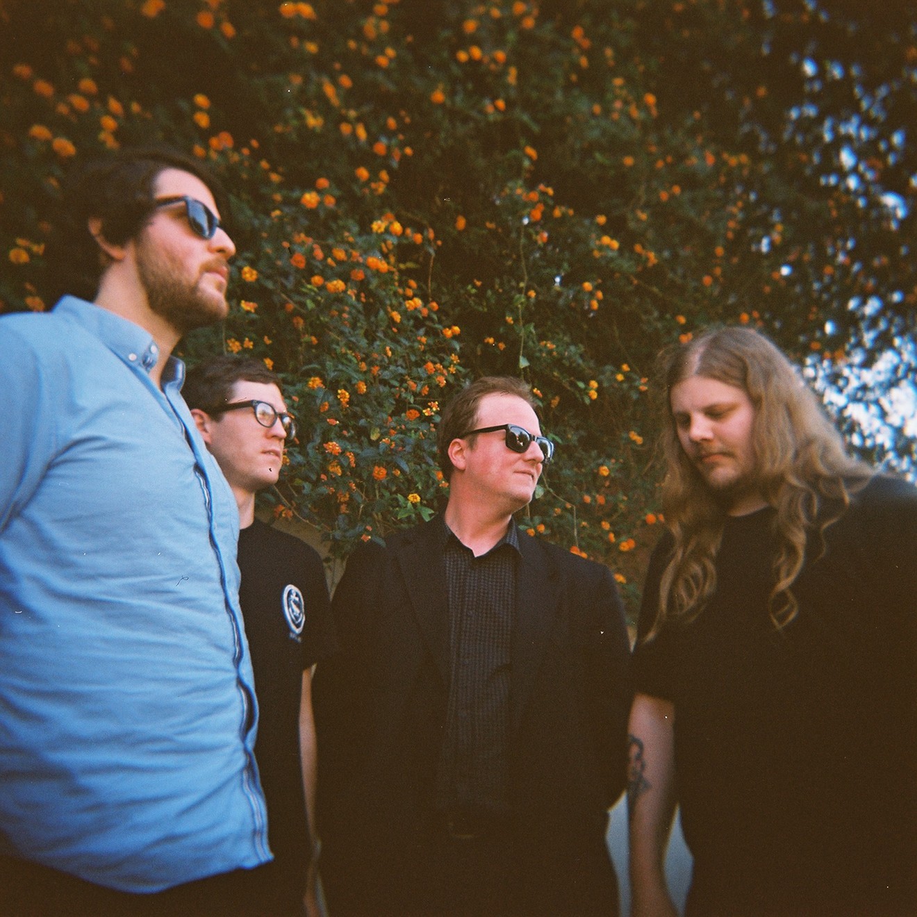 Protomartyr is pictured with Joe Casey at the center.